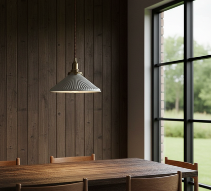 Dining room with wooden table and chairs, pendant light, and large window.