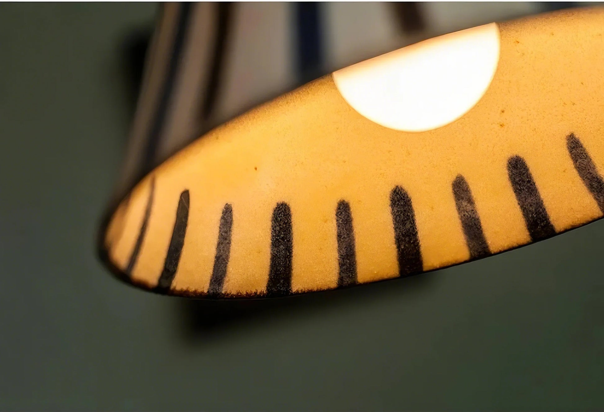 Close-up of a yellow ruler with black markings on a dark background