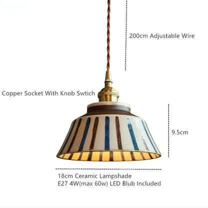 Pendant light with striped lampshade, copper socket, and LED bulb details on a white background
