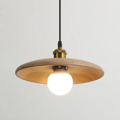 Wooden pendant light with a white bulb on a gray background