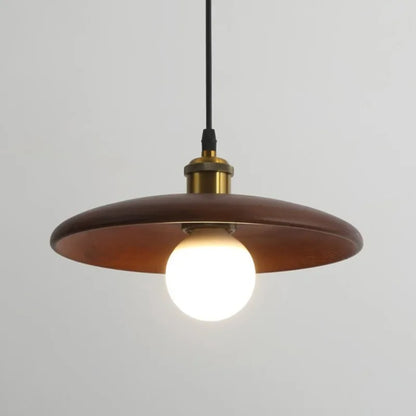 Wooden pendant light with a white bulb on a gray background